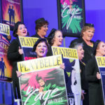 Women singing with Playbelle boards in their hand